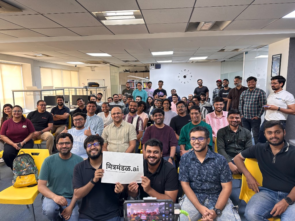 mitramandal.ai Episode 4 Pune group photo with attendees holding the मित्रमंडळ.ai sign